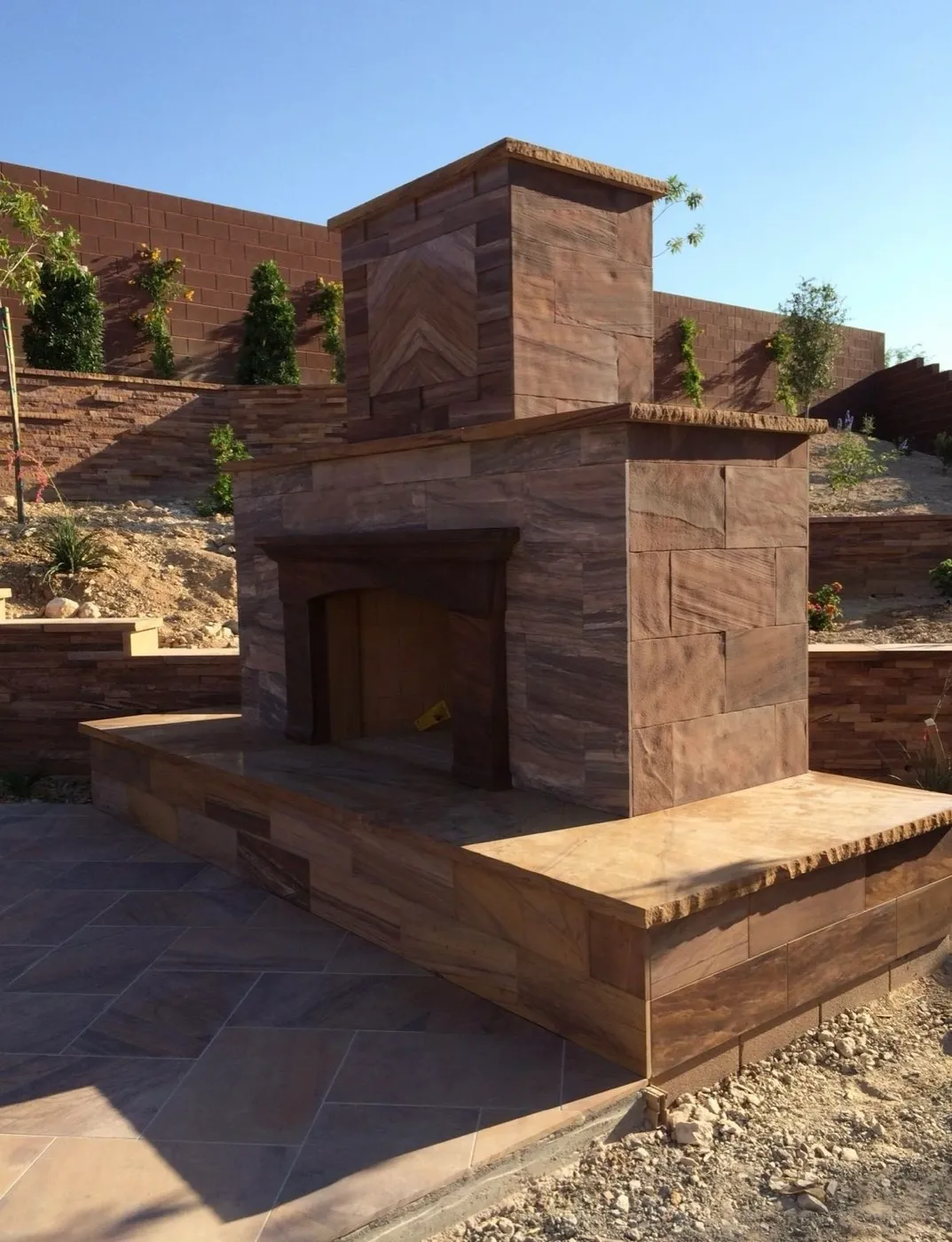 Brick outdoor fireplace built in a valley backyard